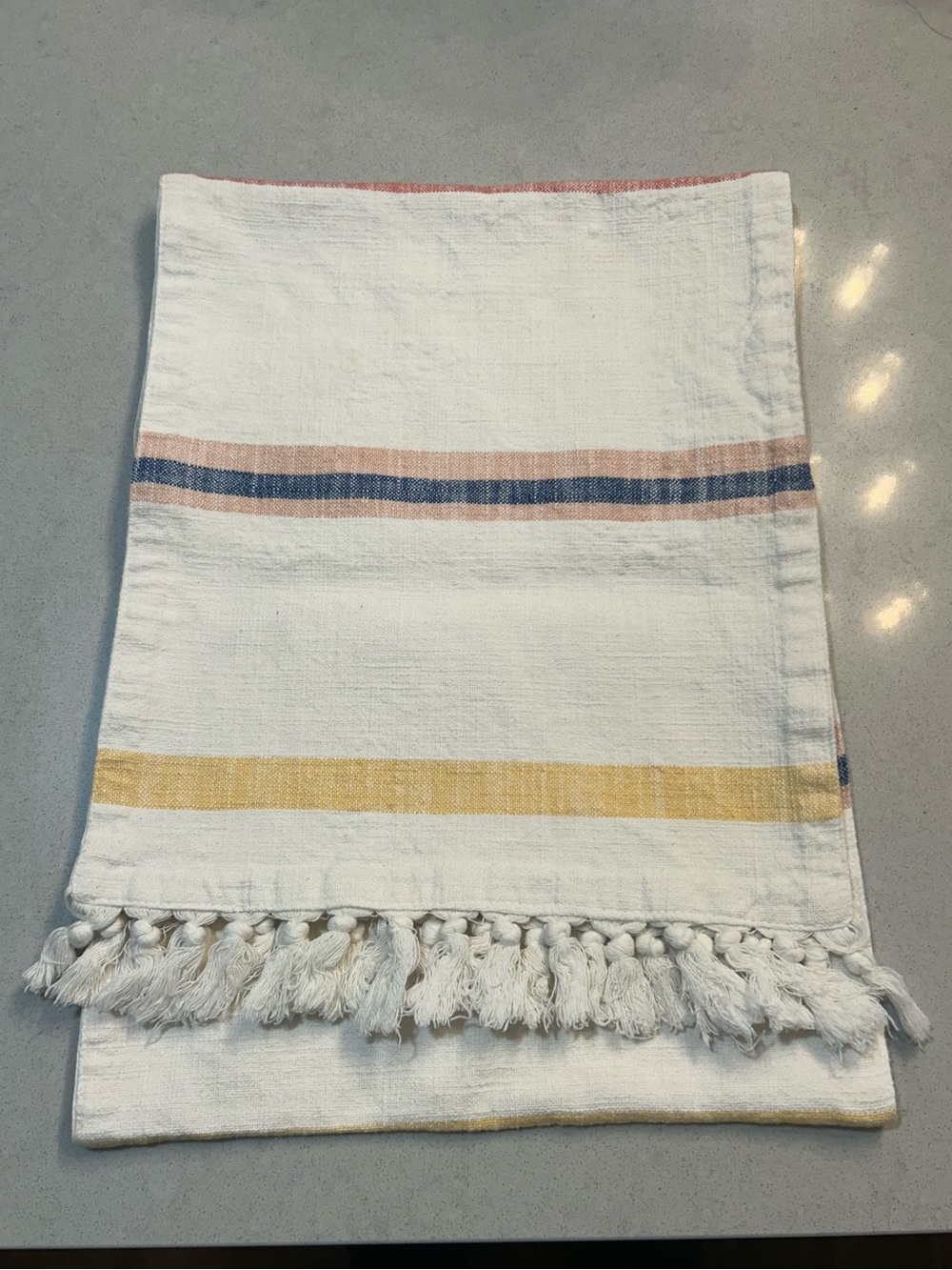 White Tassel Table Runner with Yellow, Pink, and Blue Stripes